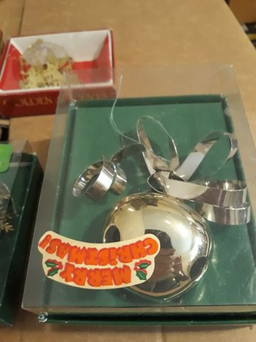 Silver bell-shaped Christmas ornaments