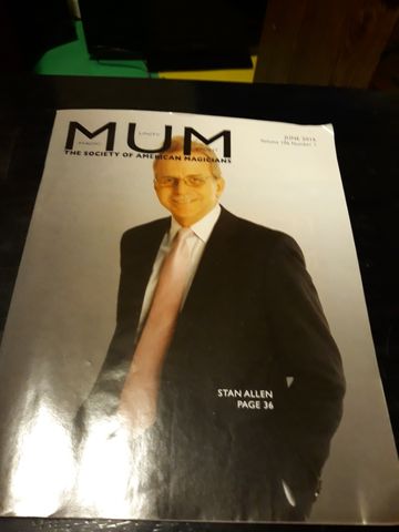 M-U-M magazine cover with a portrait of a magician