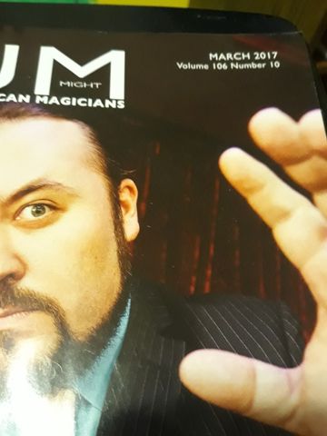 M-U-M magazine cover showing a magician mid-trick